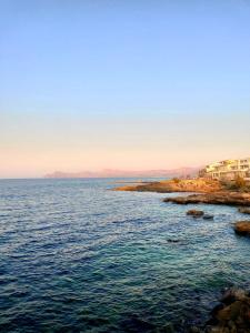 a view of a body of water with buildings at YourHouse Casa Suiza in Can Picafort