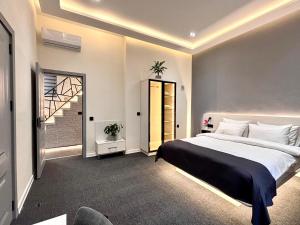 a bedroom with a large bed and a window at JM Central Boutique Hotel in Baku