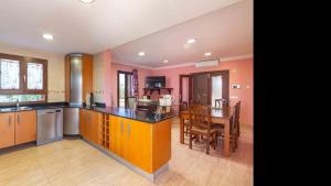 a kitchen with a table and a dining room at Son Monget in Muro