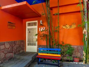 a colorful bench sitting in front of a house at Hotel Casa Anzures in Mexico City