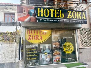 a hotel zone sign on the side of a building at Hotal zora in Rohtak