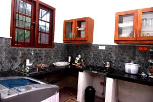 a kitchen with a sink and a counter top at AERO View Villa in Induruwa +15 photos