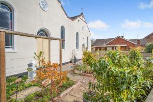 a church with a garden in front of it at 3 Bed in Crowle oc-s30617 in Crowle