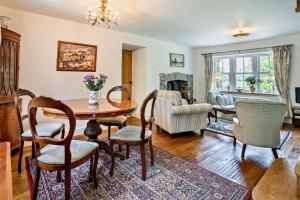 a living room with a table and chairs at 2 Bed in Blackmill oc-c29623 in Brynmenin
