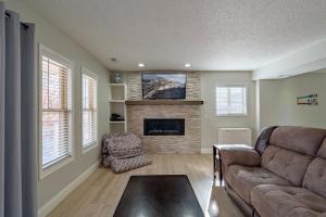 a living room with a couch and a fireplace at Barba Le Lane in Lake Ozark