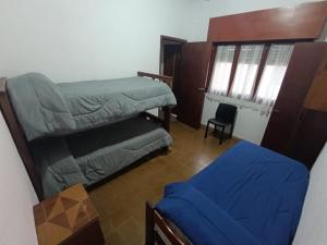a living room with a couch and a chair at Deptos Pablos, Apto No 3 in Villa Gesell