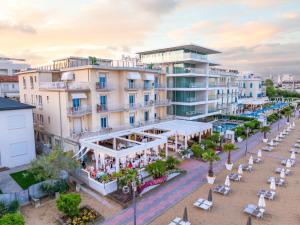 an aerial view of a resort with a beach at Hotel Bellariva in Lido di Jesolo
