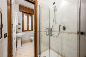 a bathroom with a shower and a sink at Emilia Studios 2 in Modena