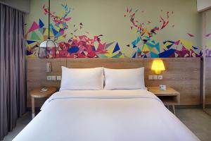 Voodi või voodid majutusasutuse Ibis Styles Bogor Raya toas