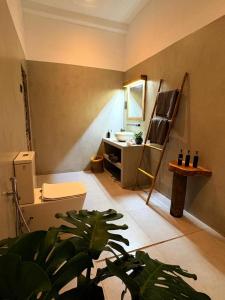 a bathroom with a sink and a toilet at Edwin's Ahangama in Ahangama