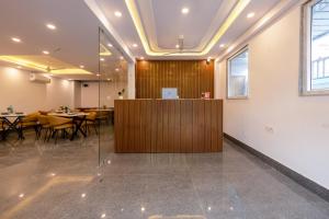 a meeting room with tables and a wooden partition at Hotel Park Tree I Sec-63A I Noida I Couple Friendly and Corporate Rooms available in Noida