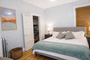 a bedroom with a large bed and a closet at Downtown Gem • King Bed • Fast WIFI in Salt Lake City