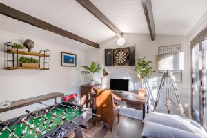 a living room with a pool table and a desk at 5 Bed in Bosham oc-h33962 in Bosham