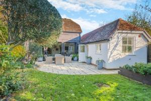 a house with a patio in the yard at 5 Bed in Bosham oc-h33962 in Bosham