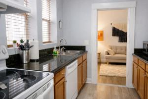 a kitchen with a sink and a counter top at Downtown Gem • King Bed • Fast WIFI in Salt Lake City