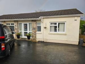 a van parked in front of a house at Shalom, in Saundersfoot, near the sea in Saundersfoot