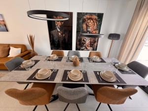 a dining room with a table with chairs at Haus Orion in Eupen