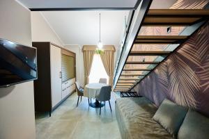 a living room with a couch and a table at Le 2 Palme Apartments in Catanzaro Lido