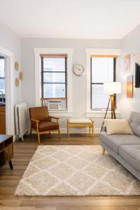 a living room with a couch and a chair at Downtown Gem • King Bed • Fast WIFI in Salt Lake City