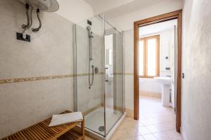 a bathroom with a shower and a sink at Emilia Studios 5 in Modena