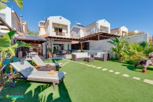 an image of a house with a lawn at Beachfront Villa Carpe Diem in Mor Menekshe +46 photos