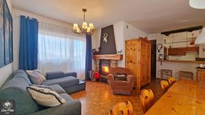 a living room with a couch and a table at Casa Polsa 1964 in Brentonico +53 photos