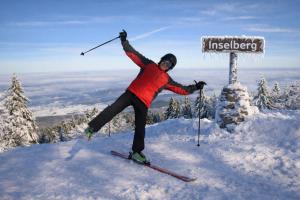 a person on skis on top of a snow covered mountain at Pension Christ in Waltershausen