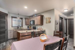 a kitchen with a table with a basket on it at Pineview Cabin Retreat in the Black Hills- 4 bed, 2 bath in Sturgis