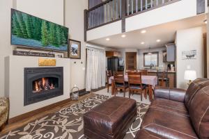 a living room with a couch and a fireplace at Pineview Cabin Retreat in the Black Hills- 4 bed, 2 bath in Sturgis