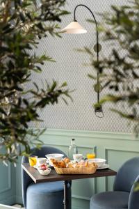 a table with a bowl of food on it at Villa V - Petit Hôtel in Valkenburg +61 photos