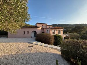 a house with a driveway in front of it at Maison Tropez in Cogolin
