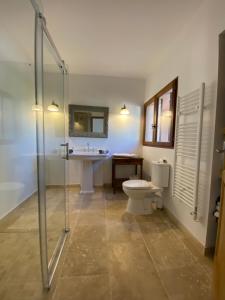 a bathroom with a shower and a toilet and a sink at Maison Tropez in Cogolin
