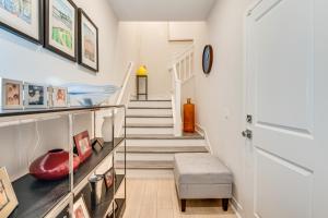 a room with stairs and a stair case at 12 Mi to DTLA! Multi-Level Charmer w/ Pool Access in Montebello +24 photos