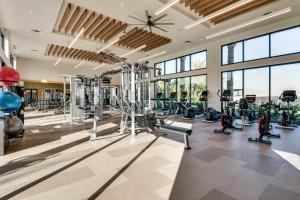 a gym with treadmills and cardio equipment in a building at 12 Mi to DTLA! Multi-Level Charmer w/ Pool Access in Montebello