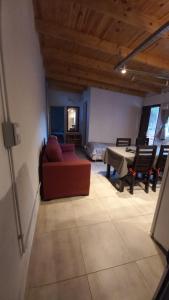 a living room with a couch and a table at Departamento familiar in General Roca +10 photos