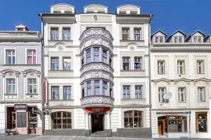 a large white building with a lot of windows at Anmut by Revelton in Karlovy Vary