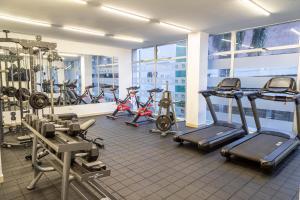 a gym with several exercise bikes and treadmills at GHL Hotel Neiva in Neiva +60 photos