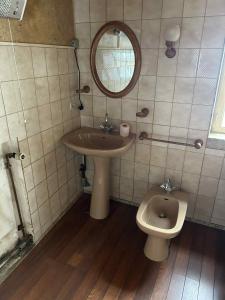 a bathroom with a sink and a toilet at maison indépendante in Millery