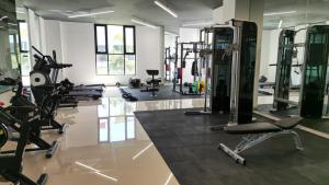 a gym with several treadmills and exercise bikes at Quiet Room w/bath + Top Amenities! in La Cañada