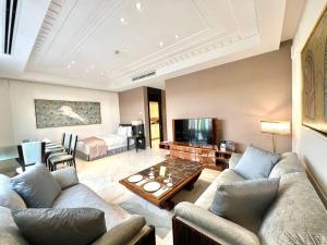 a living room with a couch and a table at Vivienda Residence in Riyadh