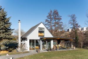 a small white house with a roof at Vilka u Dyje in Znojmo
