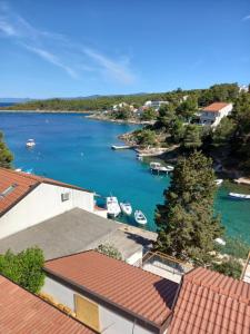 a view of a river with boats in the water at Apartmani Antonio Basina in Vrbanj