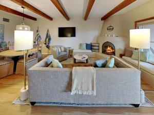 a living room with a couch and a fireplace at Casa Cielo in Santa Fe