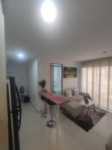 a living room with a couch and a table at Via Tayrona in Santa Marta