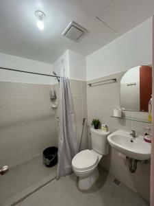 a bathroom with a toilet and a sink at Hailey's Place Unit 2 in Bacolod +37 photos
