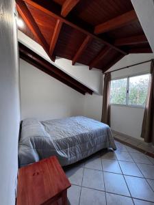 a bedroom with a bed in a room with a window at Casa Bati in El Mollar