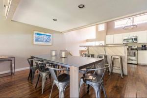 a dining room and kitchen with a table and chairs at Snowcreek 569 in Mammoth Lakes