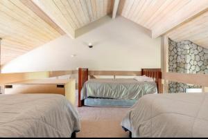 a bedroom with two beds in a room at Snowcreek 569 in Mammoth Lakes +25 photos