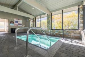 a swimming pool in a building with at Snowcreek 569 in Mammoth Lakes
