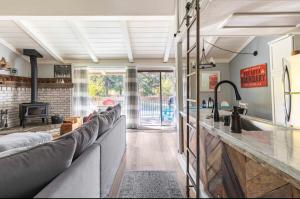 a living room with couches and a fireplace at Villa De Los Pinos 15 in Mammoth Lakes